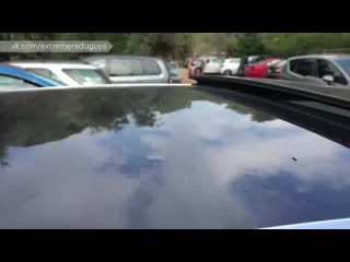 russian gay with a big cock jerks off in a car in a parking lot by the beach."